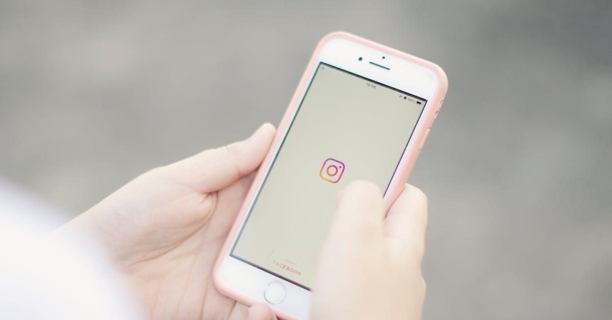Hands holding phone scrolling Instagram